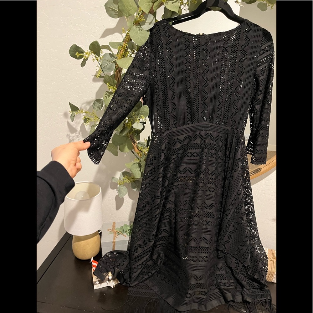Black gold zipper back midi dress with fringes on bottom back. Sz sml/medium
